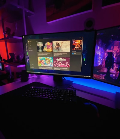 A vibrant gaming setup with a glowing monitor displaying the jueganexo app directory.